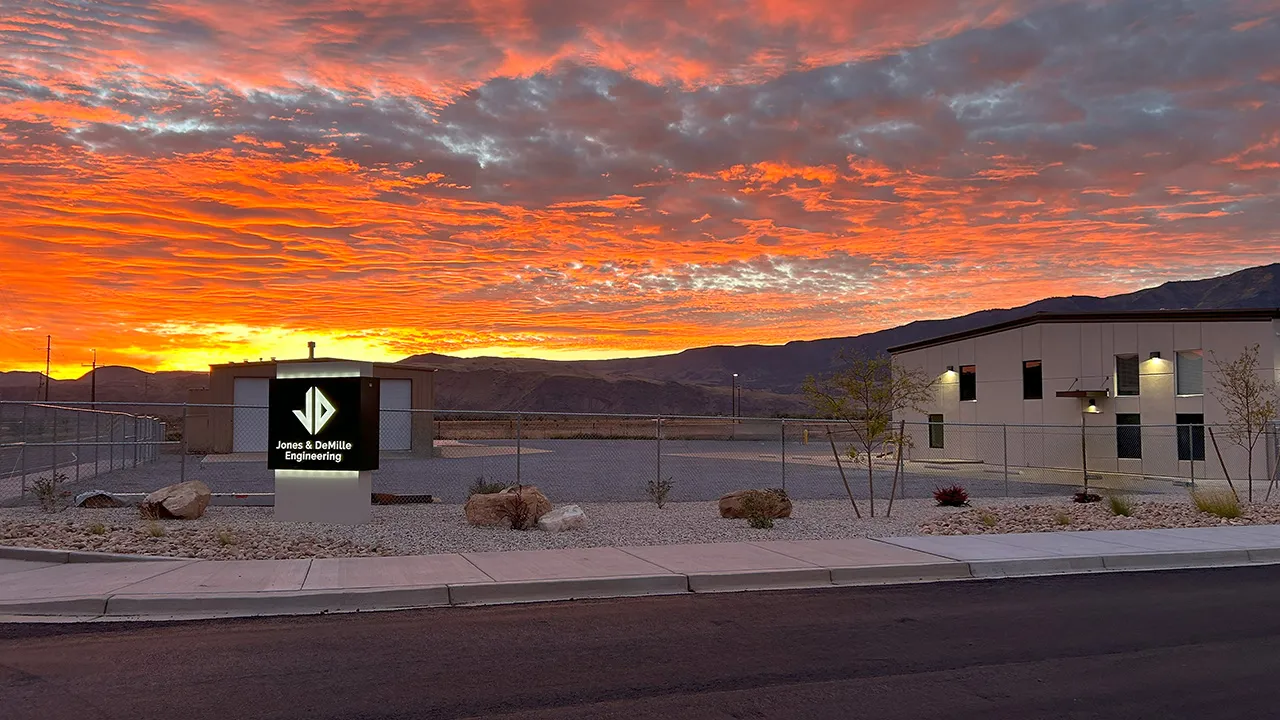 Aerial view of a highway along a reservoir — 44 years of infrastructure excellence